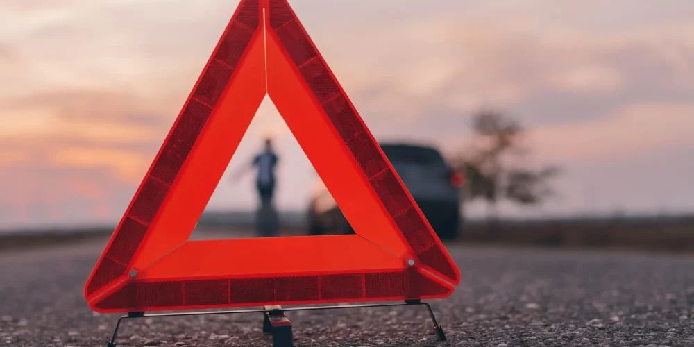 Warning triangle sign on the road